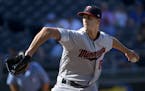 Minnesota Twins relief pitcher Taylor Rogers throws against the Kansas City Royals during the eighth inning of a baseball game in Kansas City, Mo., Su