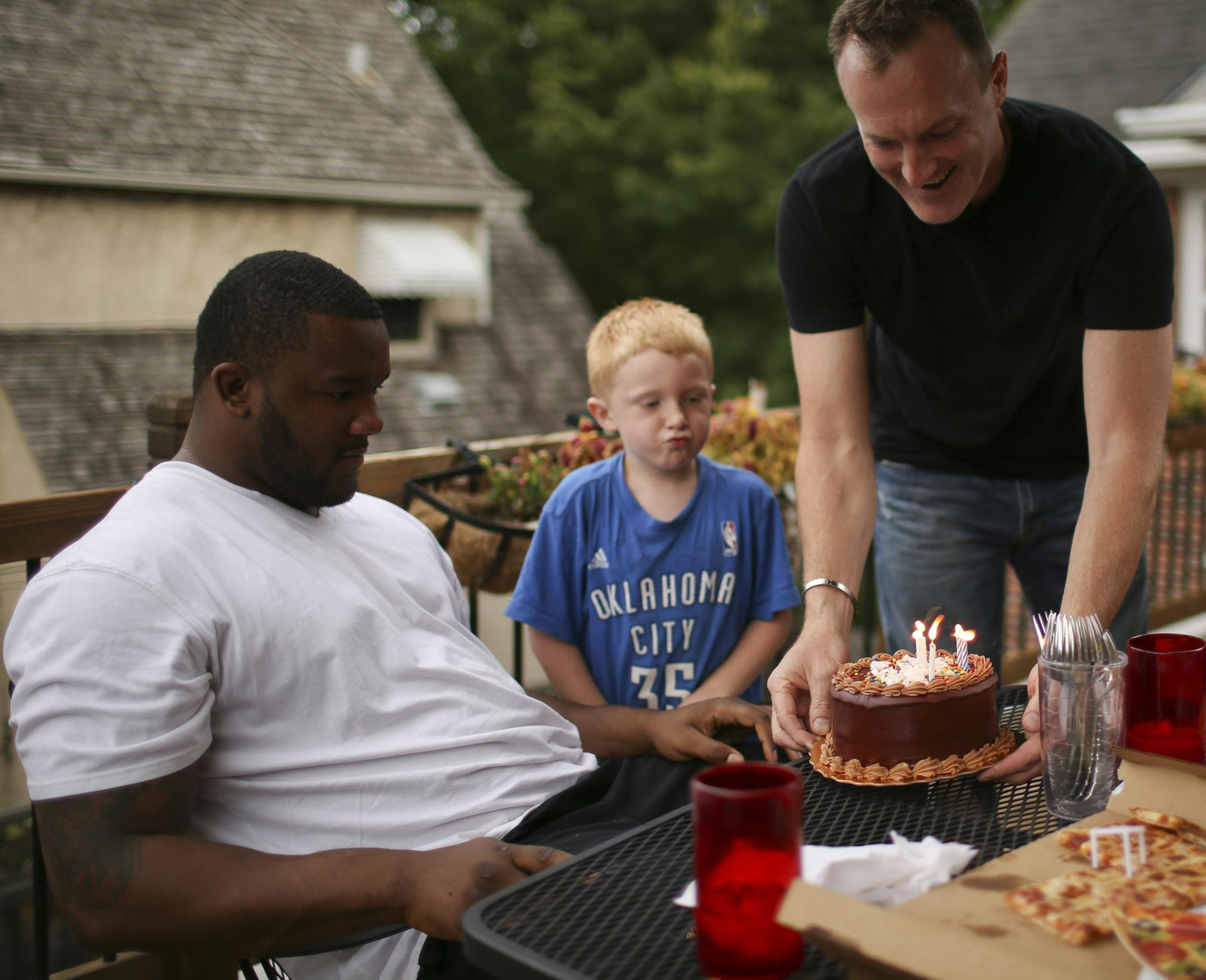 Gopher defensive tackle and Minneapolis native Ra'Shede Hageman enters his final year of college football after a breakout junior season. The Hageman family had dinner together and celebrated Ra'Shede's birthday Monday night, July 29, 2013 on the deck of their Minneapolis home. Eric Hegman presented the birthday cake for his son, Ra'Shede, while Hank, 5, looked on and Lizzy, 7, and Joe, 11, didn't. ] JEFF WHEELER ‚Ä¢ jeff.wheeler@startribune.com