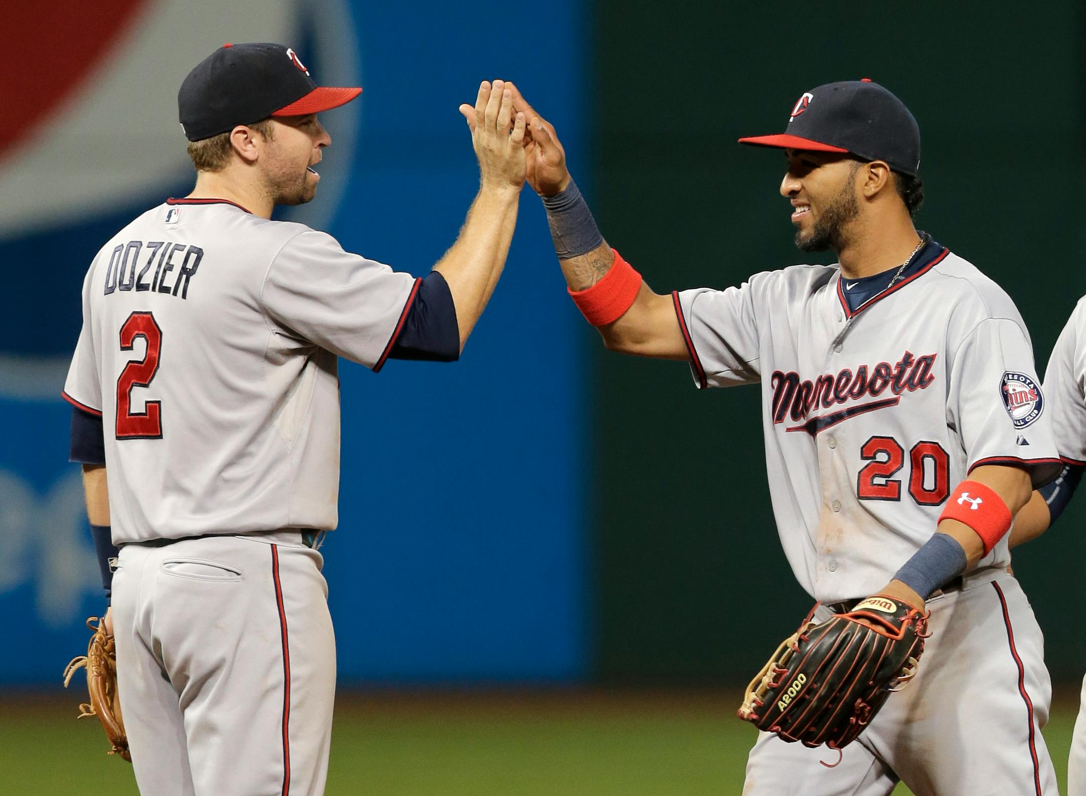 Brian Dozier and Eddie Rosario celebrated after the Twins beat the Indians 4-2 on Monday night in Cleveland.