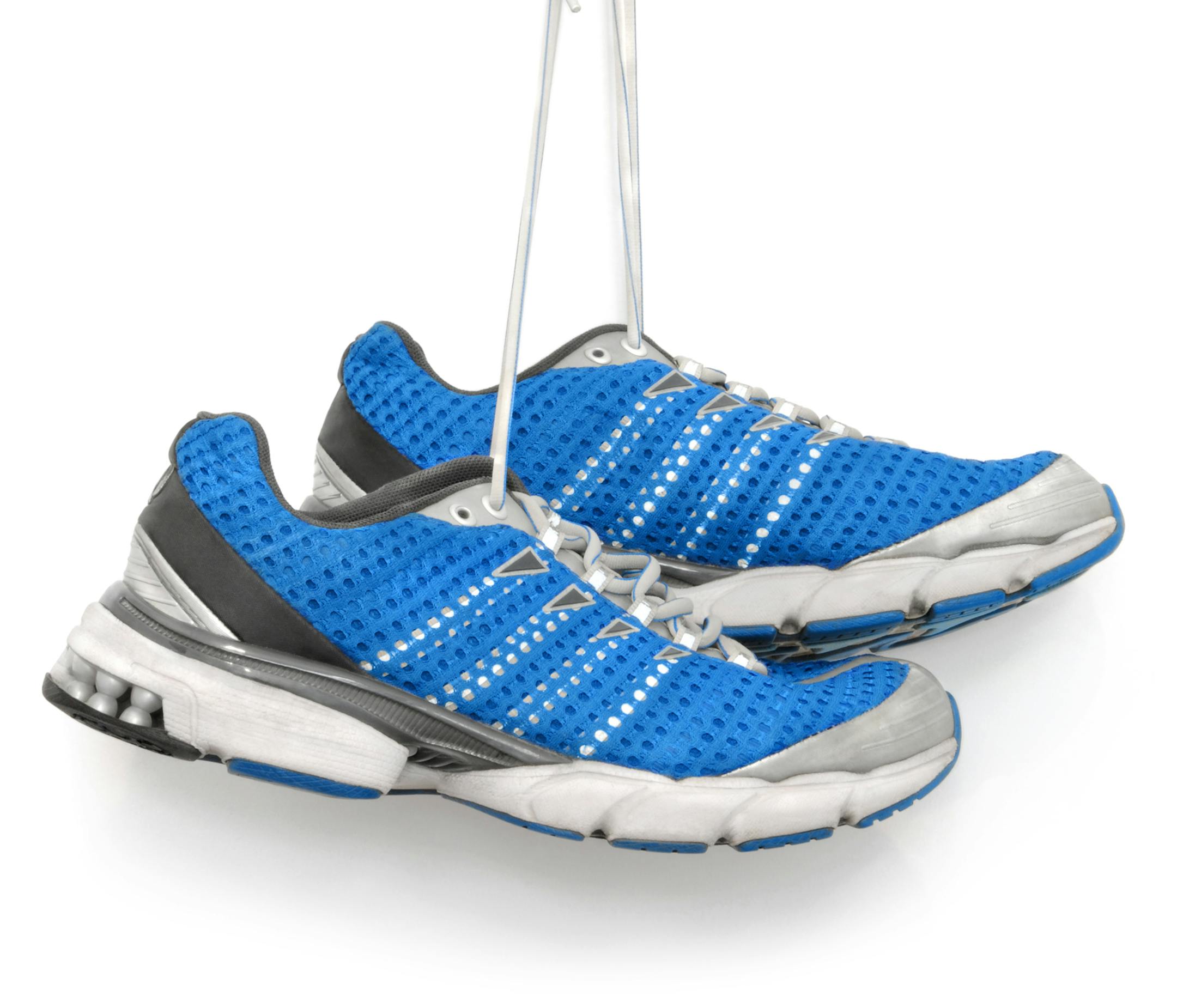 A pair of blue running shoes. Isolated on white. istock photo