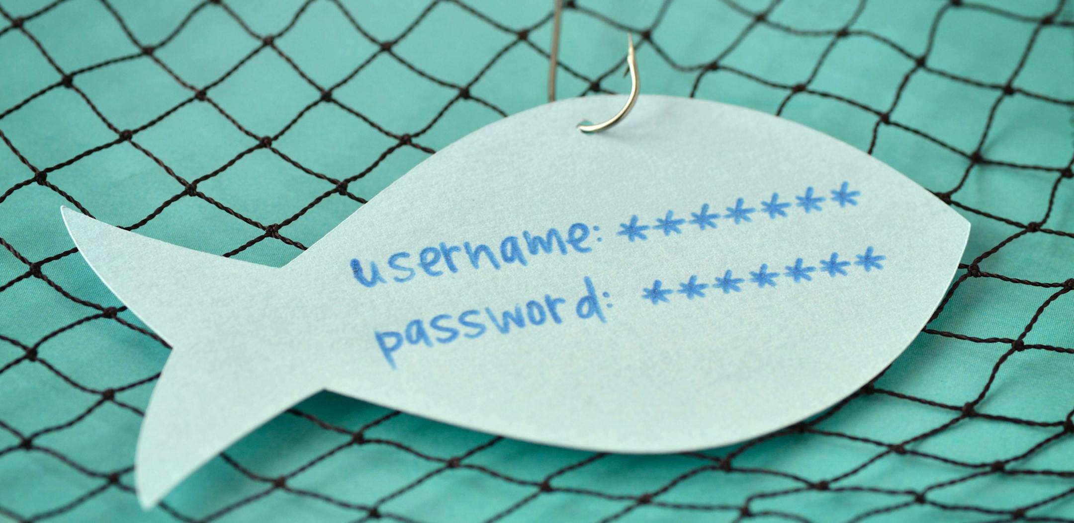istok Username and password written on a paper note in the shape of a fish attached to a hook - Phishing and internet security concept