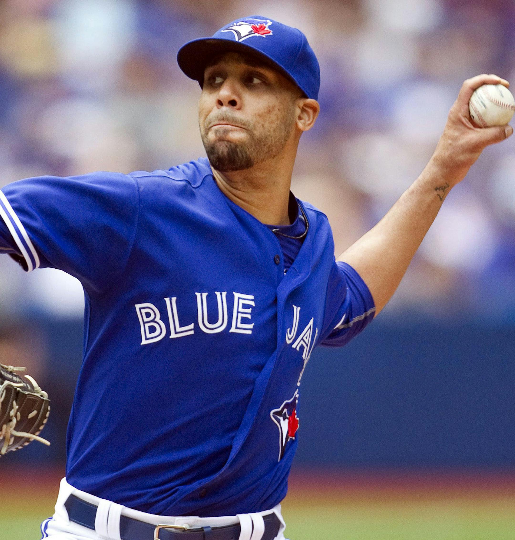 Toronto Blue Jays starting pitcher David Price throws against the Minnesota Twins during seventh inning baseball action in Toronto on Monday, Aug. 3, 2015. (Fred Thornhill/The Canadian Press via AP)