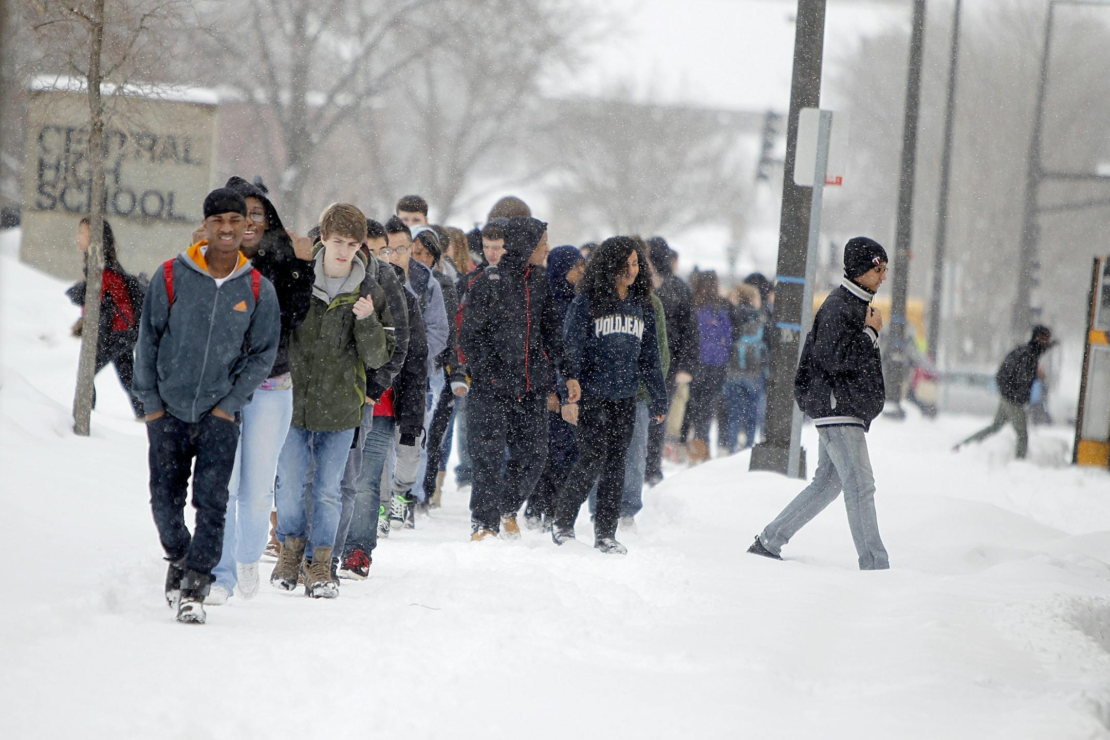 Central High School students in southwest Minneapolis made their way to school buses after being released early because of Tuesday's slushy snowfall.