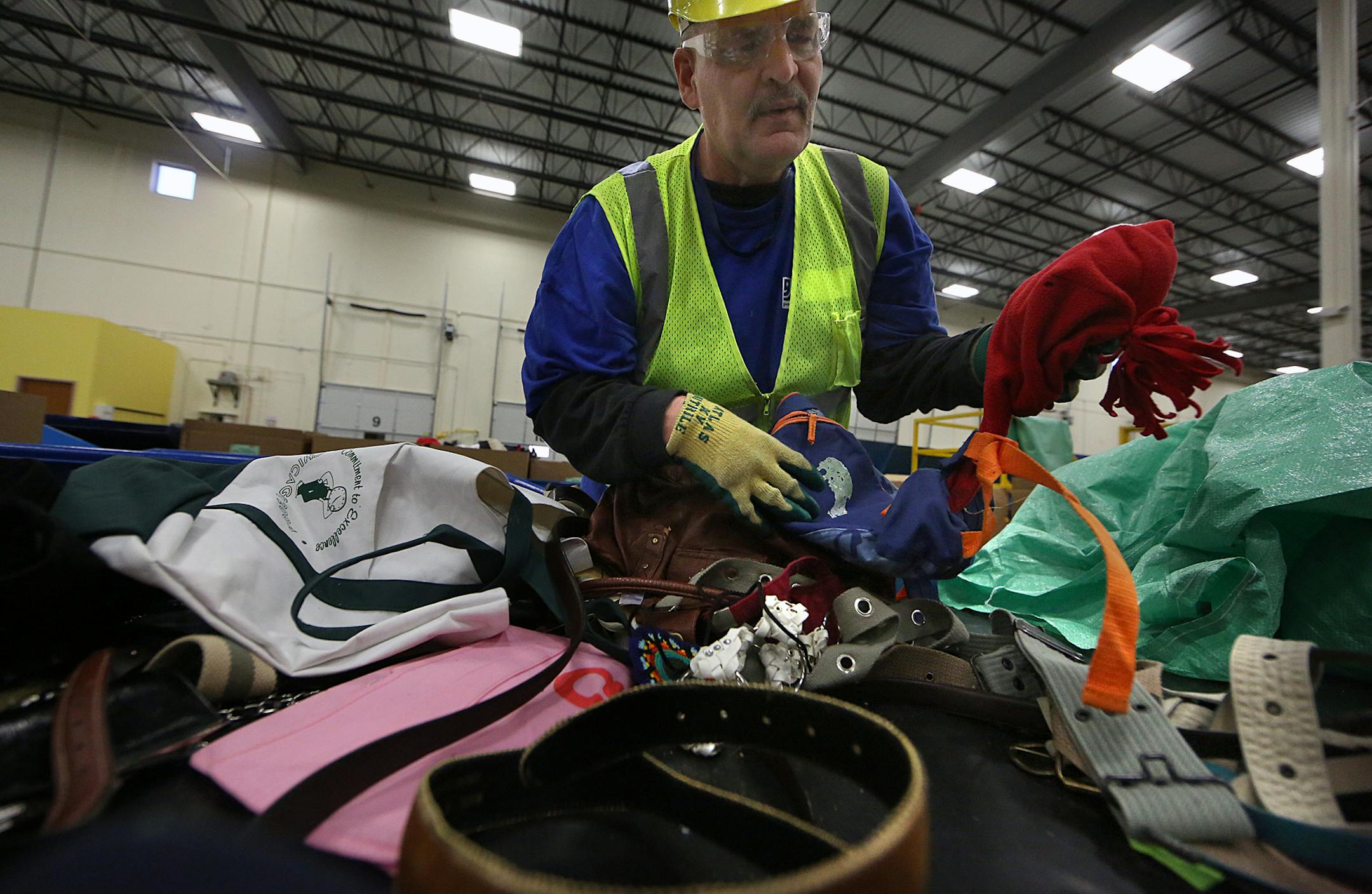 Recycling processor Travis Austin sorted accessories at the Goodwill Outlet in Brooklyn Park. ] JIM GEHRZ &#xef; james.gehrz@startribune.com / Brooklyn Park, MN / April 23, 2015 /10:00 AM - BACKGROUND INFORMATION: Charities aren't so choosy anymore. A decade ago, charities didn&#xed;t want to be the public&#xed;s dumping ground. They routinely refused clothing that was stained or torn, for example. But then discovered sources who would pay for damaged textiles. And there are other undesirables t
