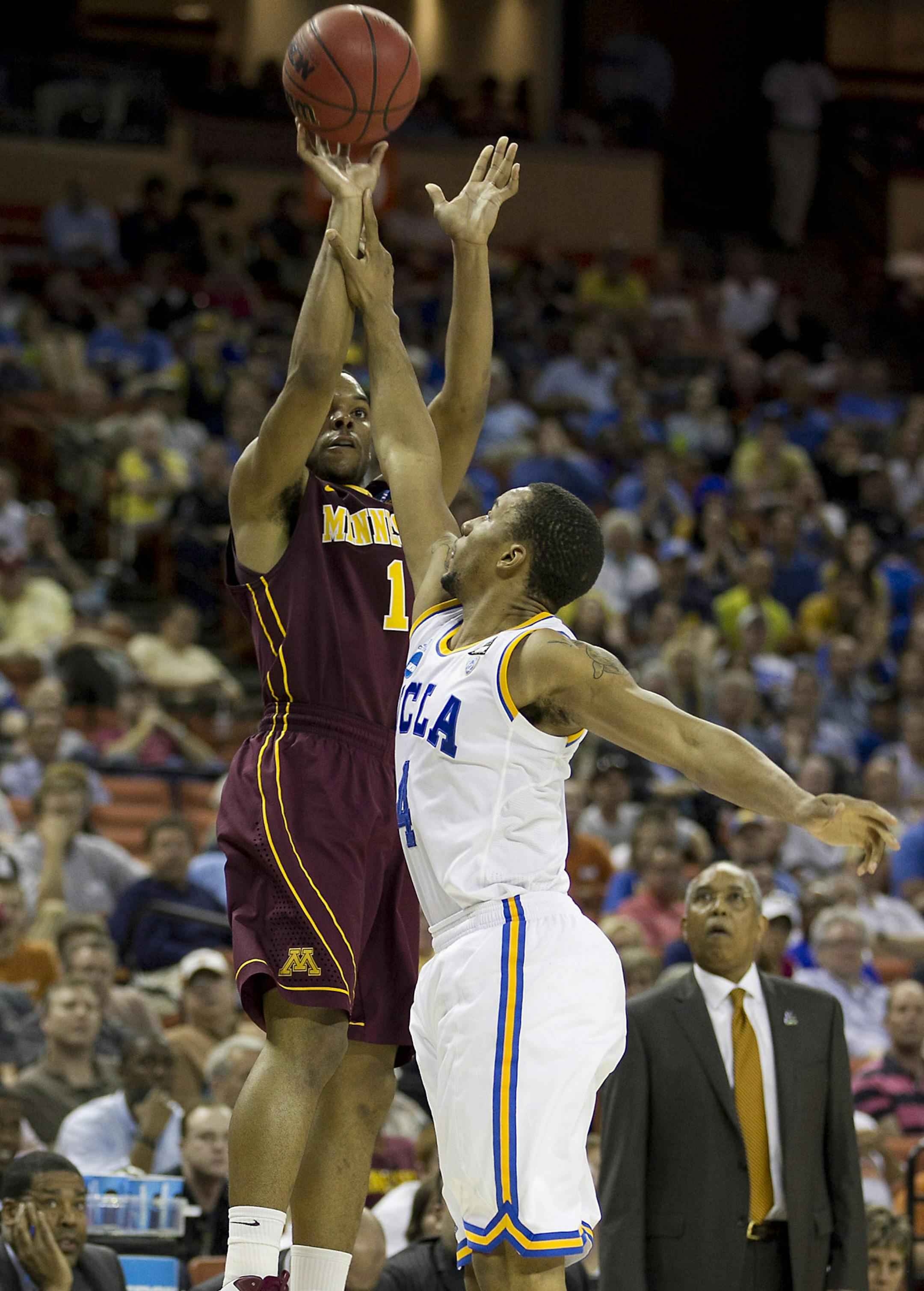 22 MAR 2013 Minnesota's (1) Andre Hollins is fouled by UCLA's (4) Norman Powell as head coach, Tubby Smith, far right, looks on in the second round of the NCAA Men's Basketball Tournament held at the Frank Erwin Center in Austin, Texas on Friday, March 22 2013. Minnesota defeated UCLA 83-63. (Special to the Minneapolis Star Tribune / Rodolfo Gonzalez) ORG XMIT: MIN1303230011450317