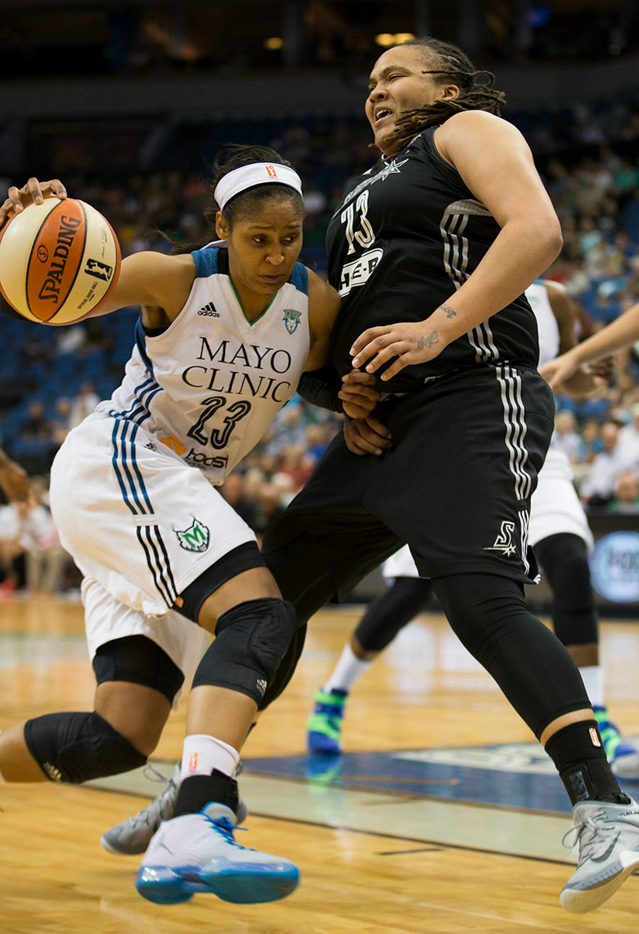 Lynx Maya Moore pushed past San Antonio's Danielle Adams in the second half. Moore score 24 points in the second half.