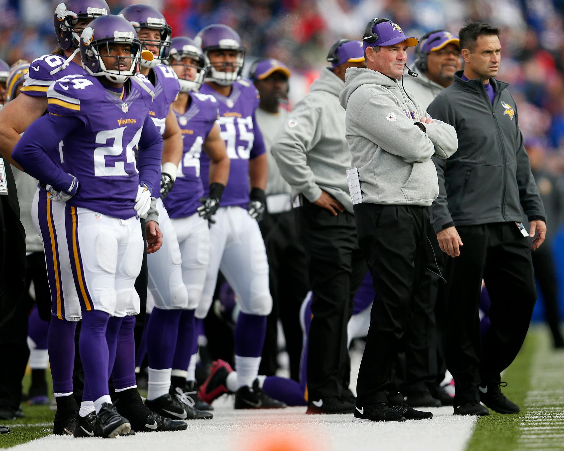 Minnesota Vikings head coach Mike Zimmer and his team watch after the Buffalo Bills scored a touchdown in the final seconds of the game on Sunday, Oct. 19, 2014, at Ralph Wilson Stadium in Orchard Park, N.Y.