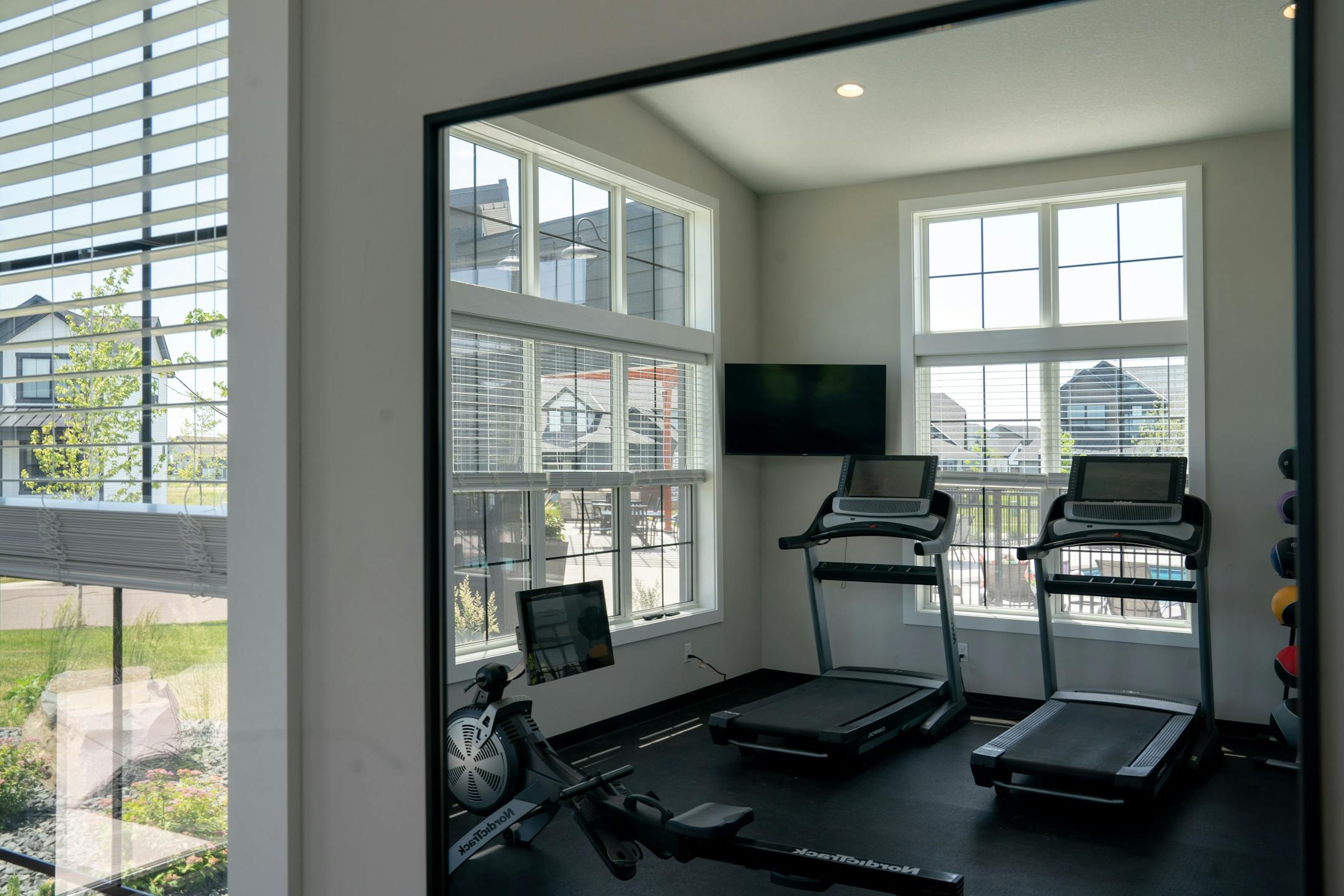 A community gym is one of the many amenities that residents can use while living in Canvas at Woodbury.