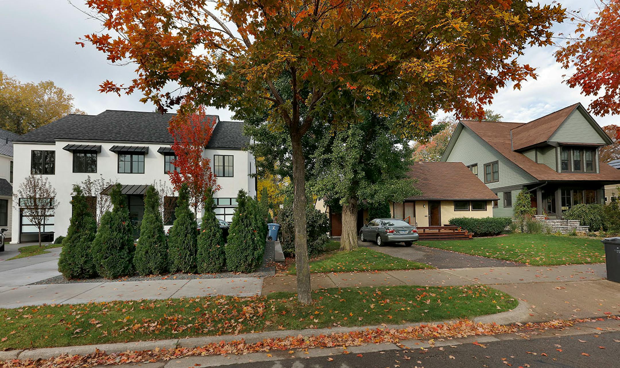Shuster's home, center, used to be surrounded by others its size. Now it's the only small original house on the block,