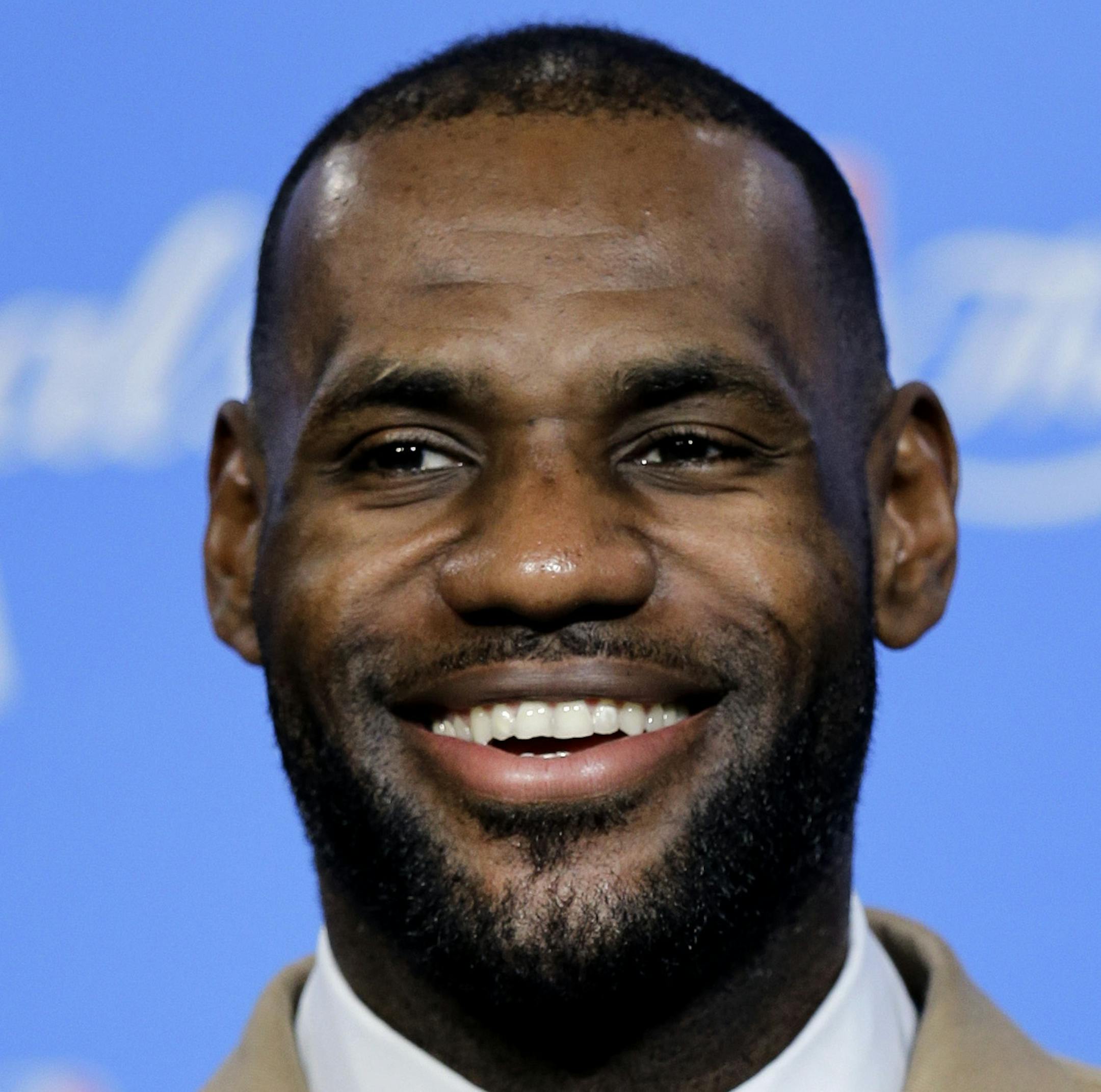 Cleveland Cavaliers' LeBron James smiles at a reporter's question early Thursday, June 9, 2016, after the Cavaliers defeated the Golden State Warriors 120-90 in Game 3 of basketball's NBA Finals in Cleveland. (AP Photo/Tony Dejak)