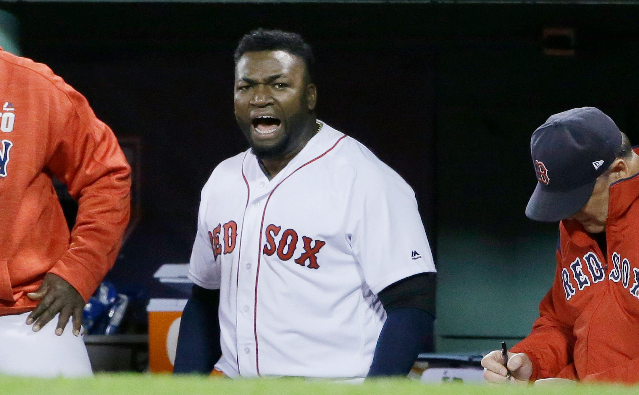 In this Oct. 10, 2016, file photo, Red Sox designated hitter David Ortiz encouraged the crowd from the dugout during Game 3 of the American League Division Series against the Cleveland Indians. Ortiz was shot and wounded in his native Dominican Republic.