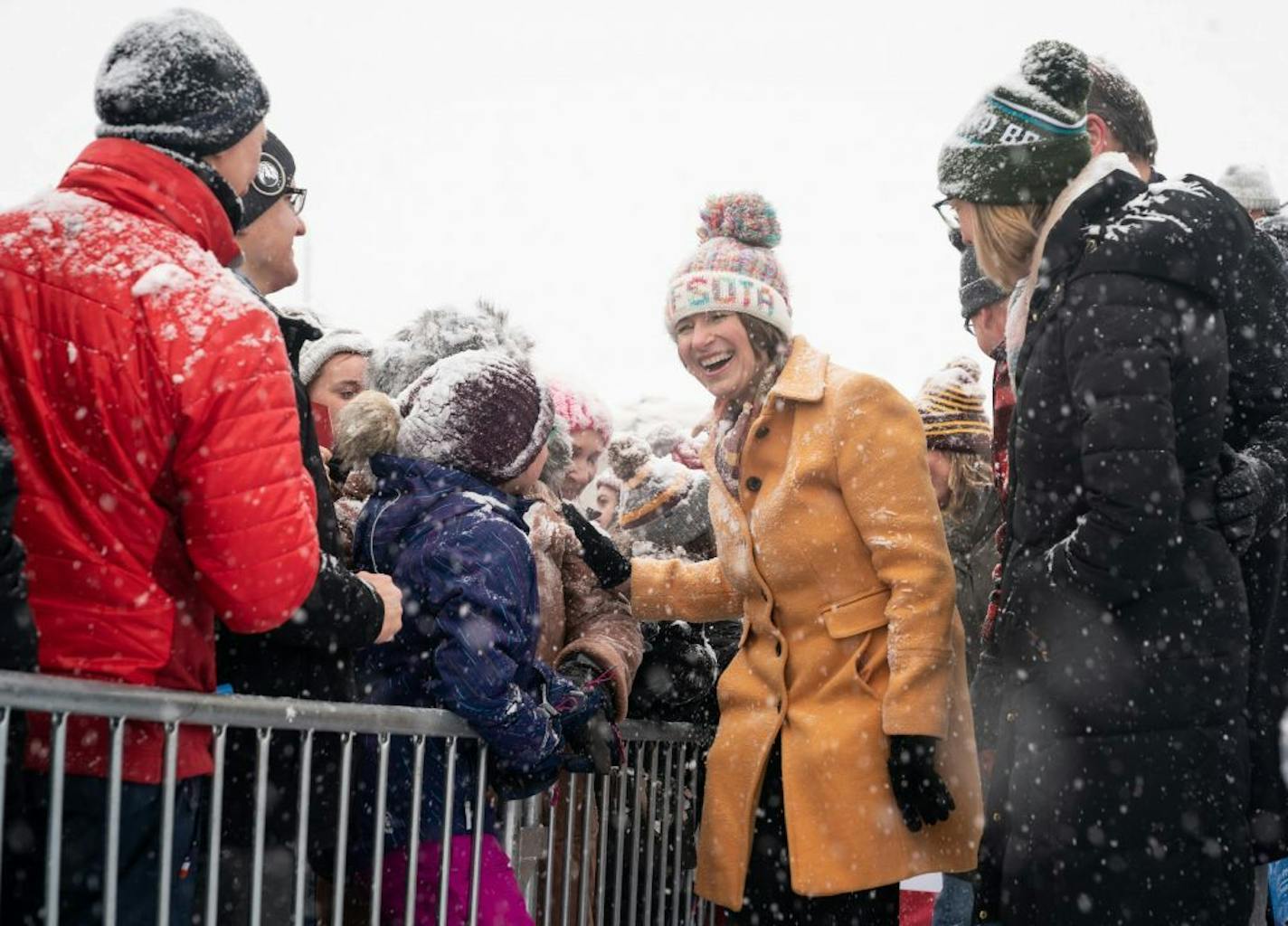 Sen. Amy Klobuchar was joined by her daughter Abigail and husband John as she shook hands after her speech. She made her announcement to run for president from a snowy Boom Island Park in Minneapolis.