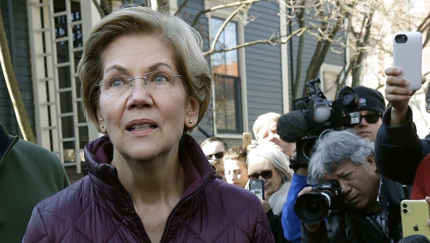 Sen. Elizabeth Warren, D-Mass., pauses while speaking outside her home, Thursday, March 5, 2020, in Cambridge, Mass., after she dropped out of the Democratic presidential race. (AP Photo/Steven Senne)