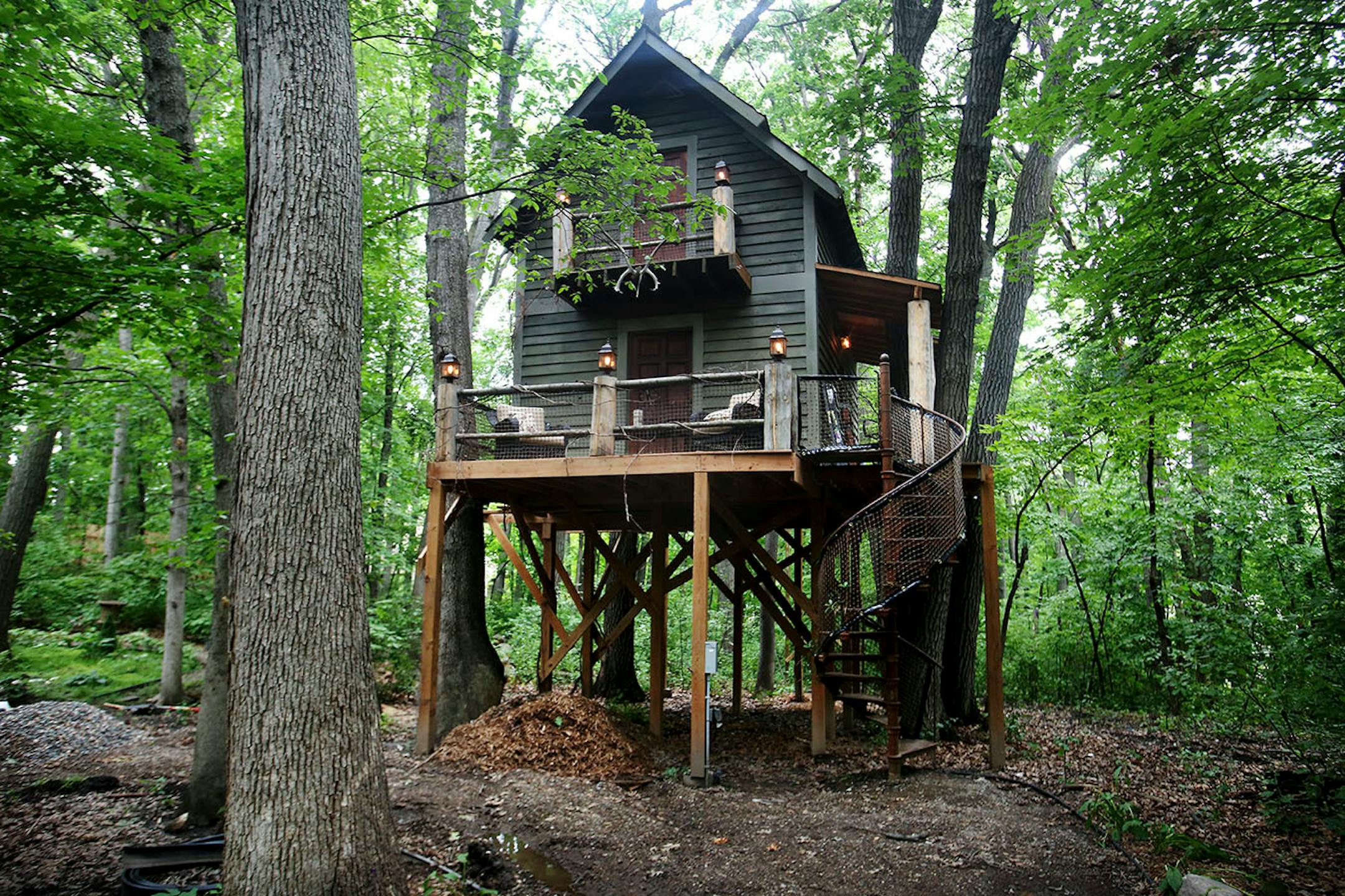 Magician Matt Dunn, whose home sits on 3 acres of wooded land in Plymouth, built a deluxe, two-story treehouse that serves as his man cave.