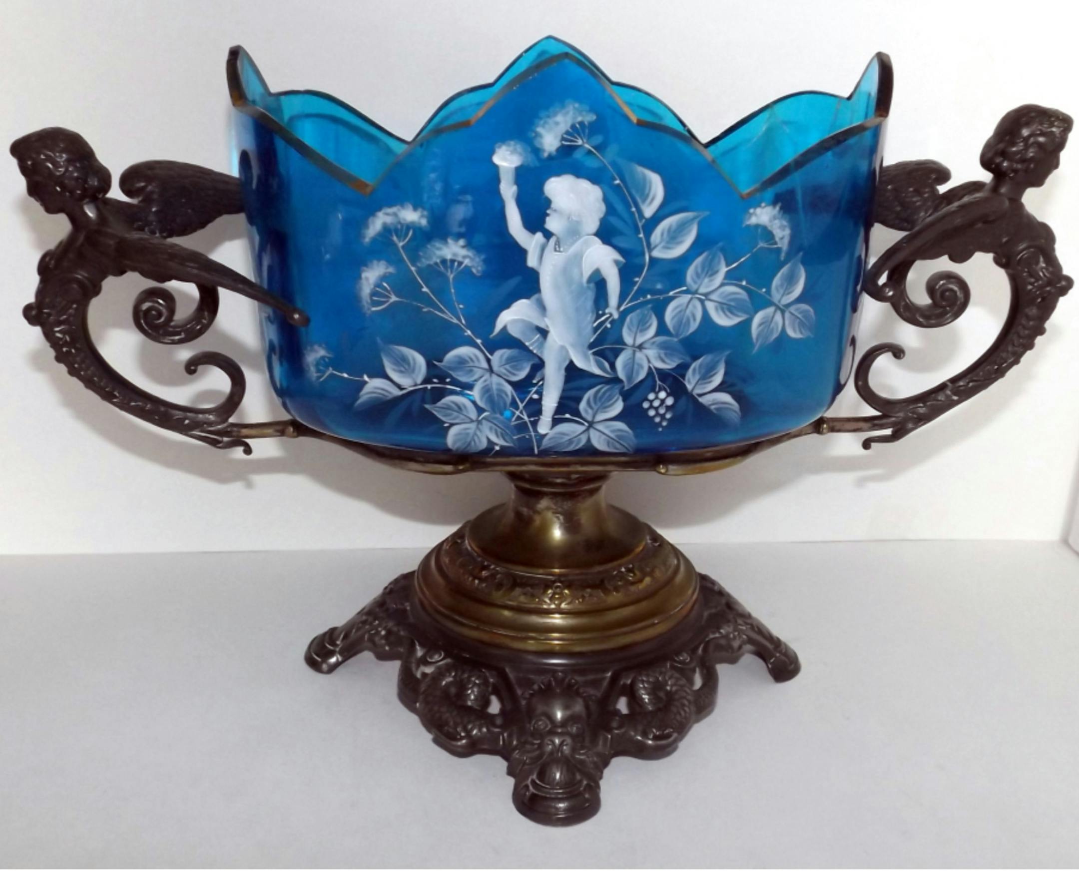 This is a wonderful example of a type of glass called Mary Gregory. (Handout)