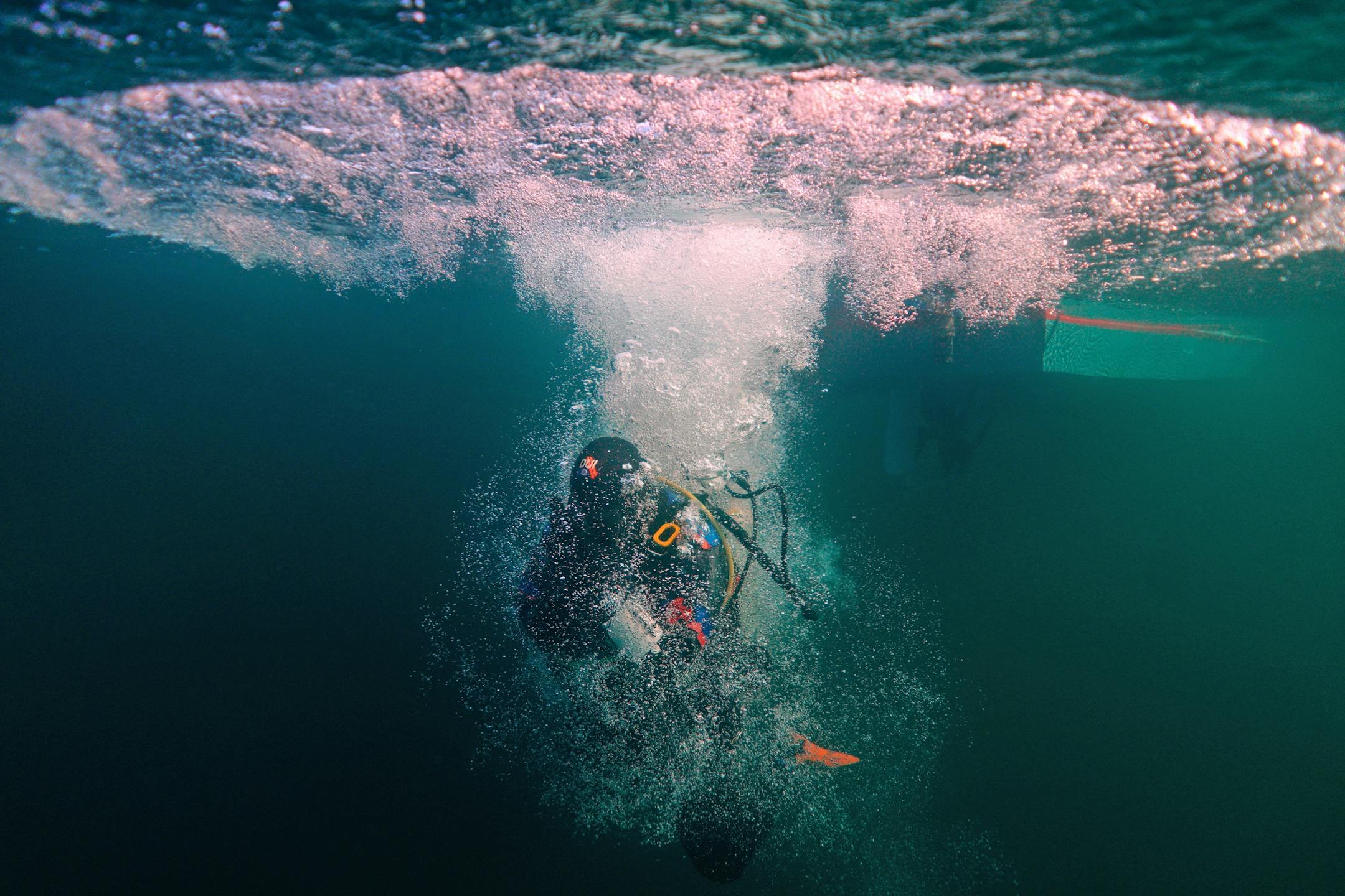Jack Decker, a diver with the Great Lakes Shipwreck Preservation Society from Clear Lake, Iowa, splashed into the water after making a giant stride entry from the group's boat the RV Preservation to dive the Hesper.