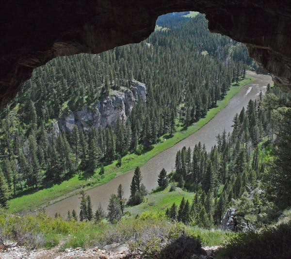 Caves used by Native Americans thousands of years ago overlook Montana's Smith River as it flows through steep limestone bluffs.