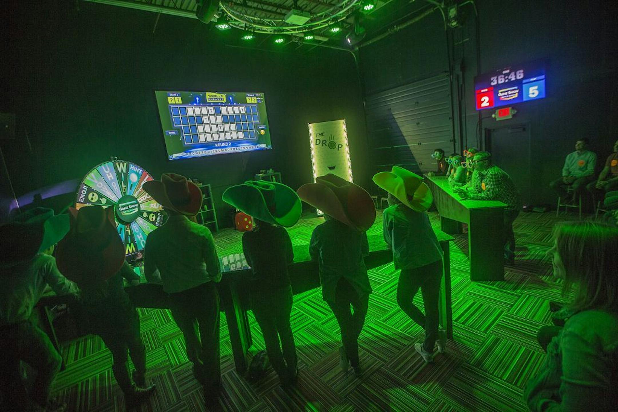 Visitors wore funny hats and sunglasses as they played a game of "Wheel of Phrases," much like "Wheel of Fortune," at the "Game Show Battle Room," Thursday, October 19, 2017 in Golden Valley, MN.