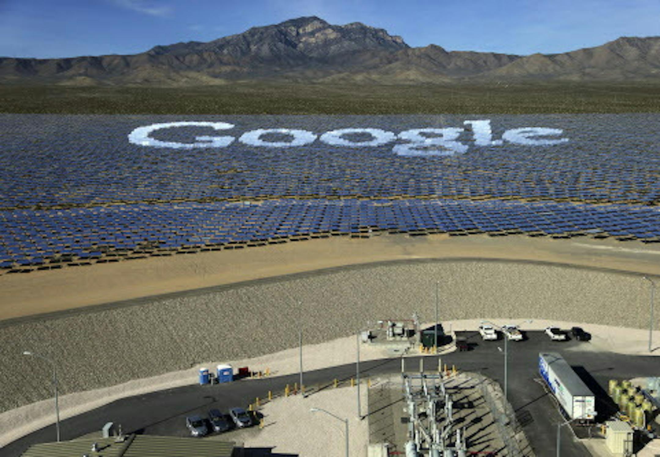 Mirrors spell out the name of Google, one of the sponsors for the Ivanpah solar power plant in Nipton, Calif., Feb. 13, 2014. The plant officially opened Thursday, the largest and first electric generator of its kind, but since the project began, the price of rival technologies has plummeted, incentives have begun to disappear and the appetite among investors for mammoth solar farms has waned. (Jim Wilson/The New York Times)