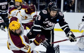 The Gophers' Connor Kurth (10) and Nebraska Omaha's Kirby Proctor (3) collided during the first round of the NCAA men's hockey tournament in the Sioux
