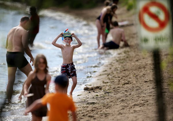 With temps soaring into the high 80s, the traffic on the Lake Harriet beach resembled more July than May Friday, May 6, 2016, in Minneapolis, MN.](DAV