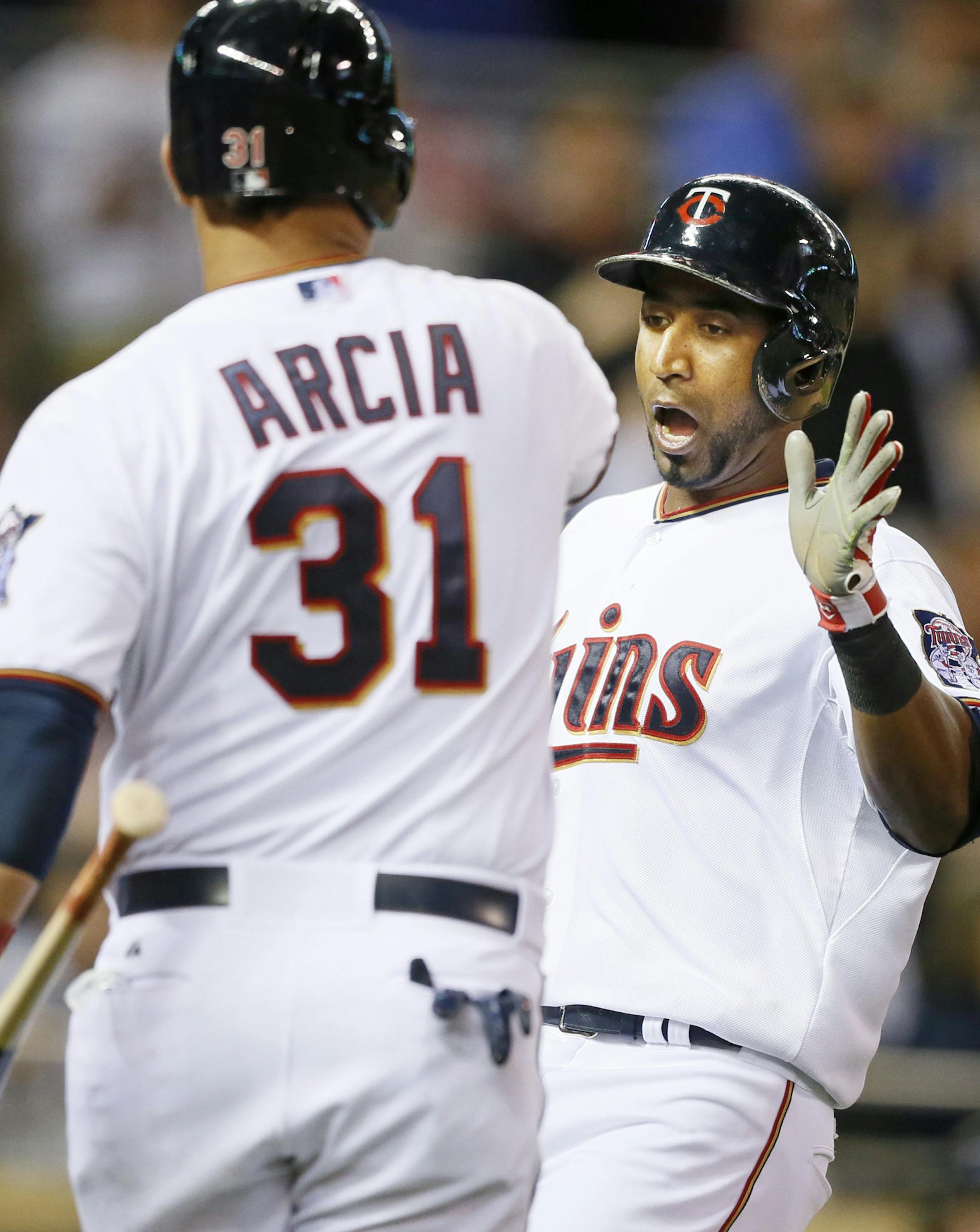 Eduardo Escobar celebrated as scored in the seventh inning with Oswaldo AricaTuesday April 28, 2015 in Minneapolis, Minnesota at Target Field . Minnesota Twins hosted the Detroit Tigers at Target Field.] Jerry Holt/ Jerry.Holt@Startribune.com