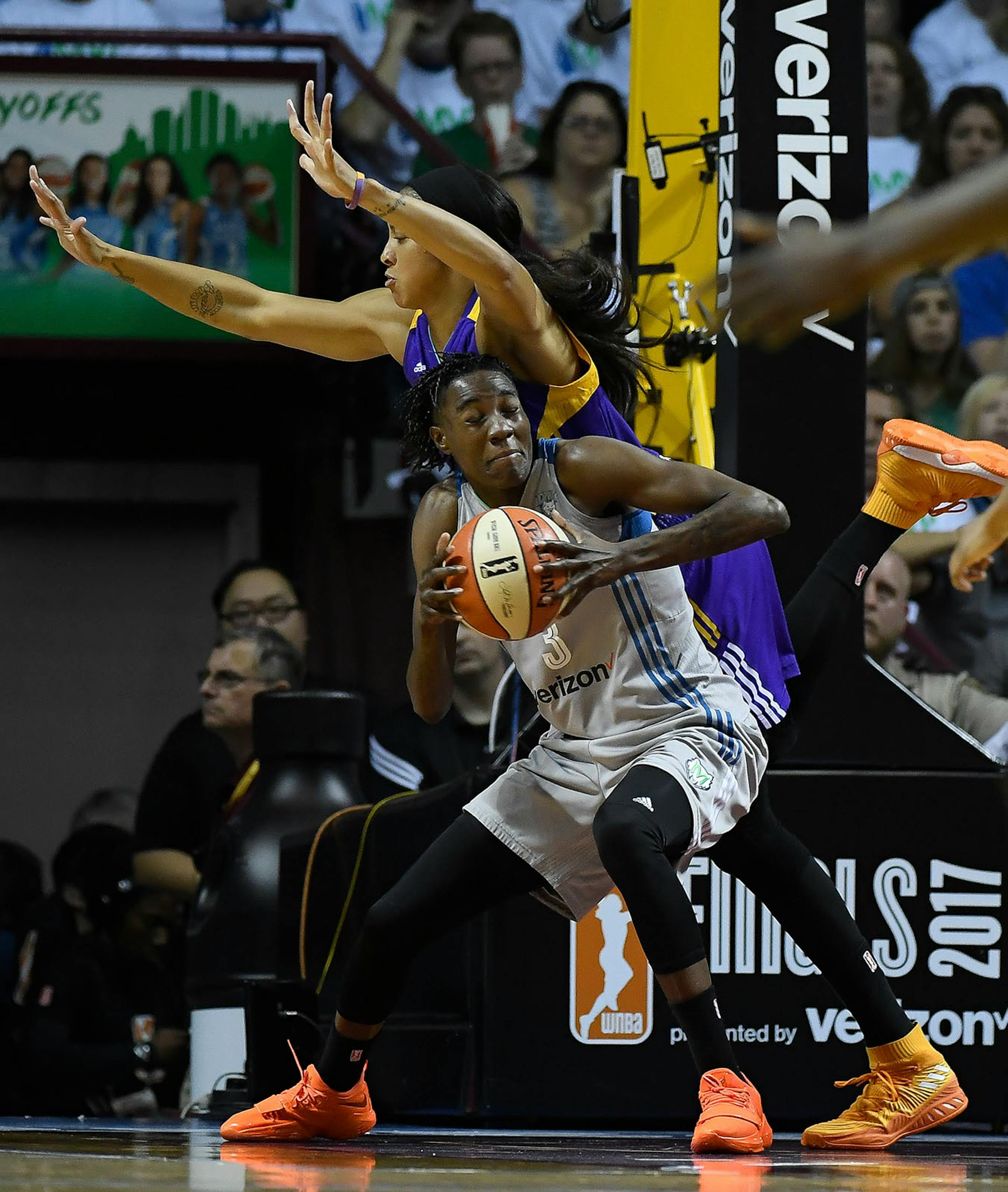 Los Angeles Sparks forward Candace Parker (3) fouled Minnesota Lynx forward Natasha Howard (3) below Minnesota's basket in the first quarter.