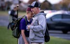 First base coach Chris Ordner hugged his son Caleb Ordner 12, on the Bulldogs' last game of the season.