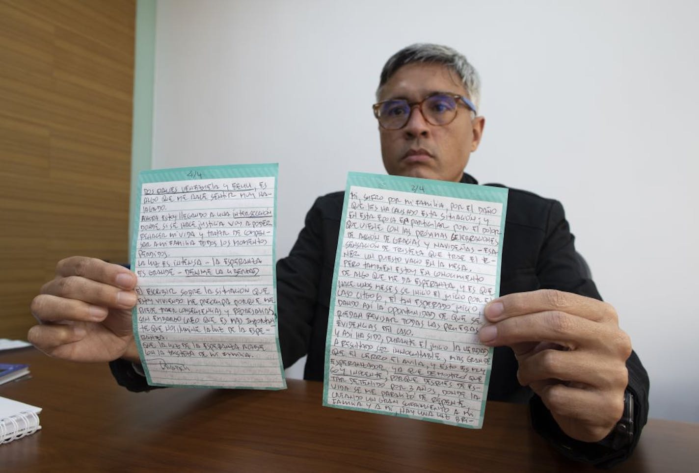 Jesus Loreto, an attorney representing Tomeu Vadell, one of six U.S. oil executives jailed for three years in Venezuela, shows a letter written by Vadell, in Caracas, Venezuela, Wednesday, Nov. 25, 2020. In the letter provided exclusively to The Associated Press on Tuesday, Nov. 24, 2020, Vadell pleads for freedom, reflects on his past and shares the pain he feels over being separated from his wife, three adult children and a newborn grandson he's never held.