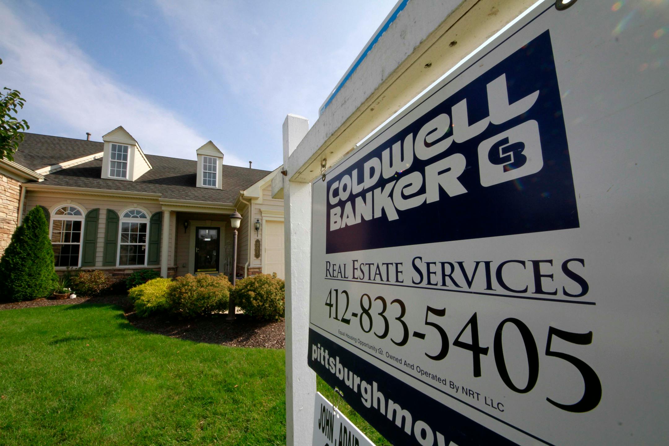 In this Oct. 18, 2011 photo, a "for sale" sign hangs in the yard of a home in Bridgeville, Pa. The National Association of Realtors said Thursday, Oct. 20, 2011 that home sales dropped 3 percent in September to a seasonally adjusted annual rate of 4.91 million homes. That's below the 6 million that economists say is consistent with a healthy housing market. (AP Photo/Gene J. Puskar)