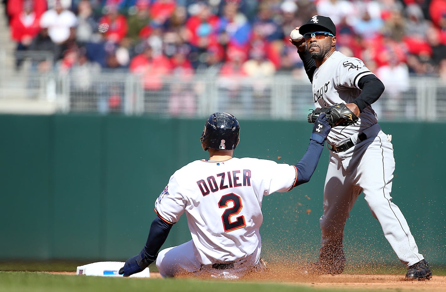 Chicago White Sox shortstop Jimmy Rollins made a double play tagging Brian Dozier out at second during the first inning.