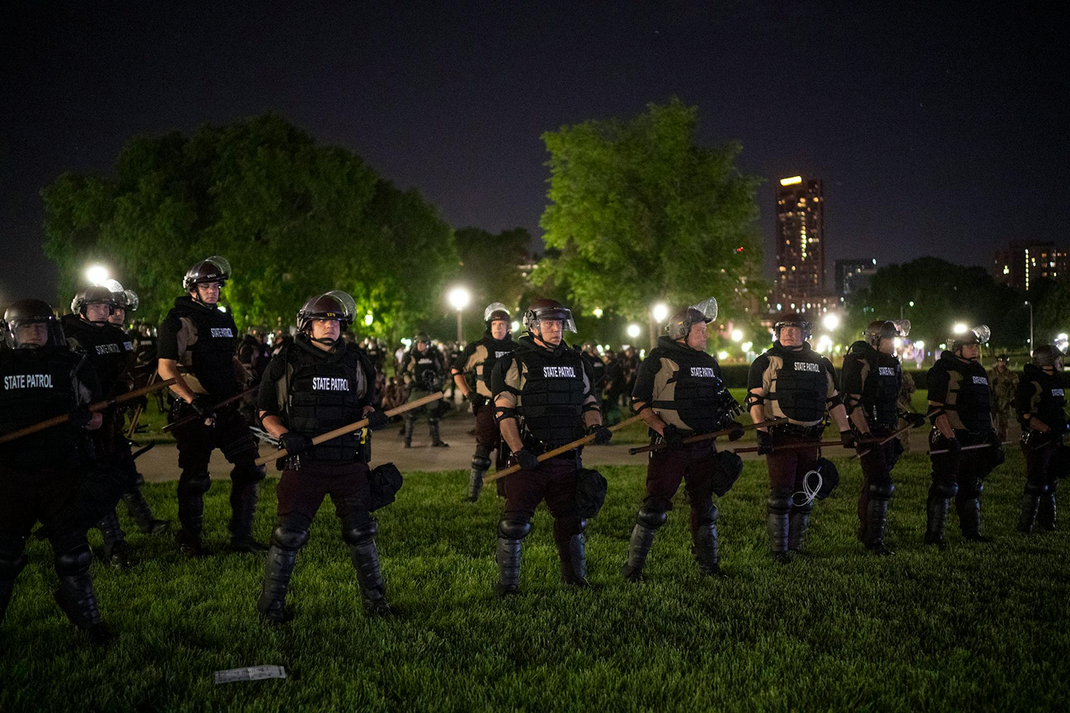 State Patrol officers formed a perimeter between the media and the officers arresting the demonstrators.