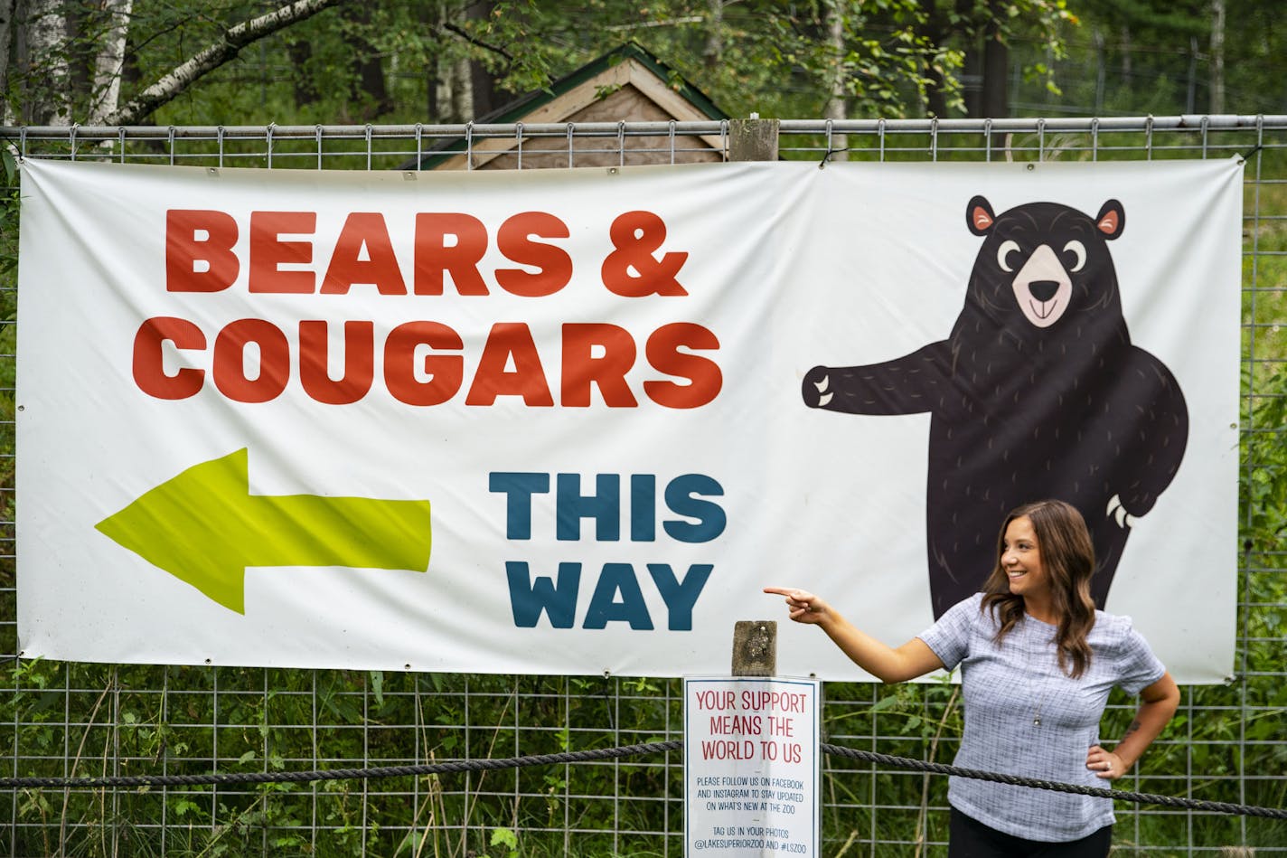 Lake Superior Zoo CEO Haley Cope posed for a portrait in front of one of the signs directing visitors to the bear and cougar exhibits on Friday August 14, 2020. ] ALEX KORMANN • alex.kormann@startribune.com Lake Superior Zoo has hired a new CEO, Haley Cope, who has taken over amidst the COVID-19 pandemic during the 97th year of the zoo's existence.