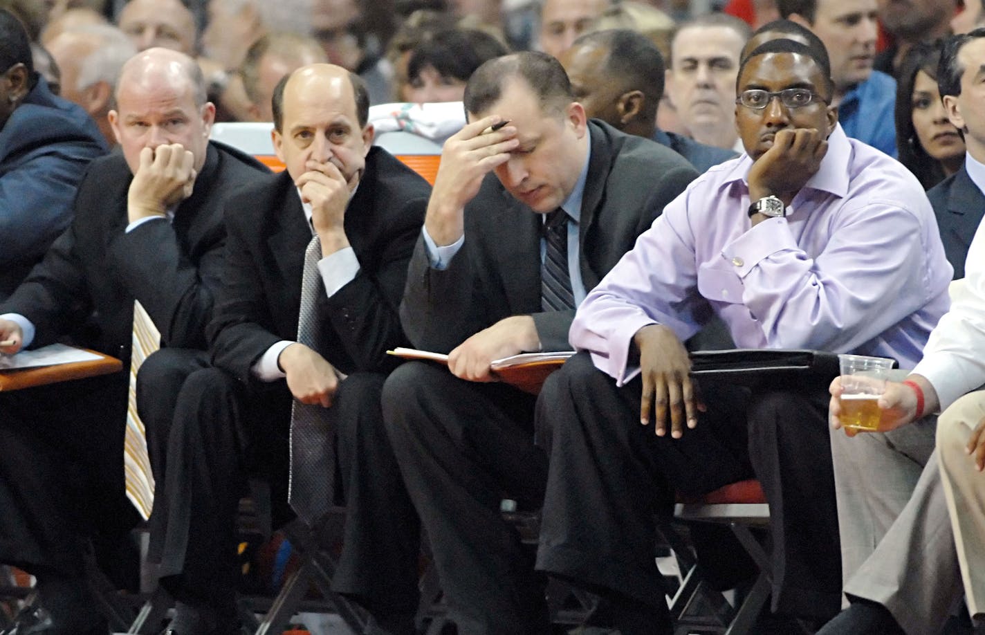 Houston Rockets coaches Steve Clifford, left, Jeff Van Gundy, left center, Tom Thibodeau, right center, and trainer, Keith Jones, right, watch in the fourth quarter of their basketball game against the San Antonio Spurs, Wednesday, April 19, 2006 in Houston. The Rockets lost to the Spurs 89-87, and closed out their season 34-48.(AP Photo/Tim Johnson) ORG XMIT: TXTJ105