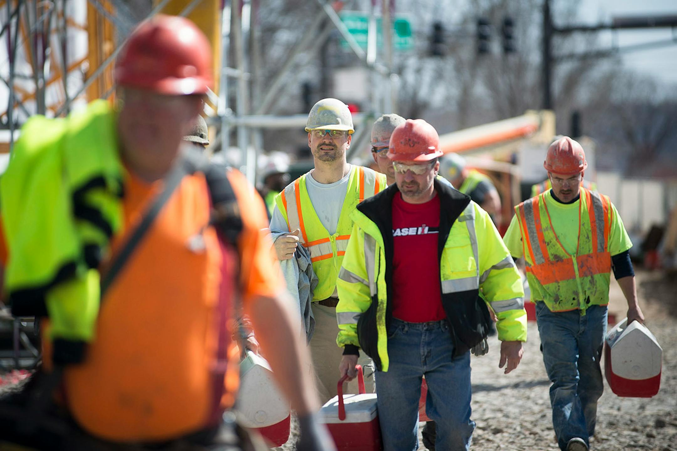 Construction workers leave the Senate Office Building construction site at the end of their work day on Tuesday.