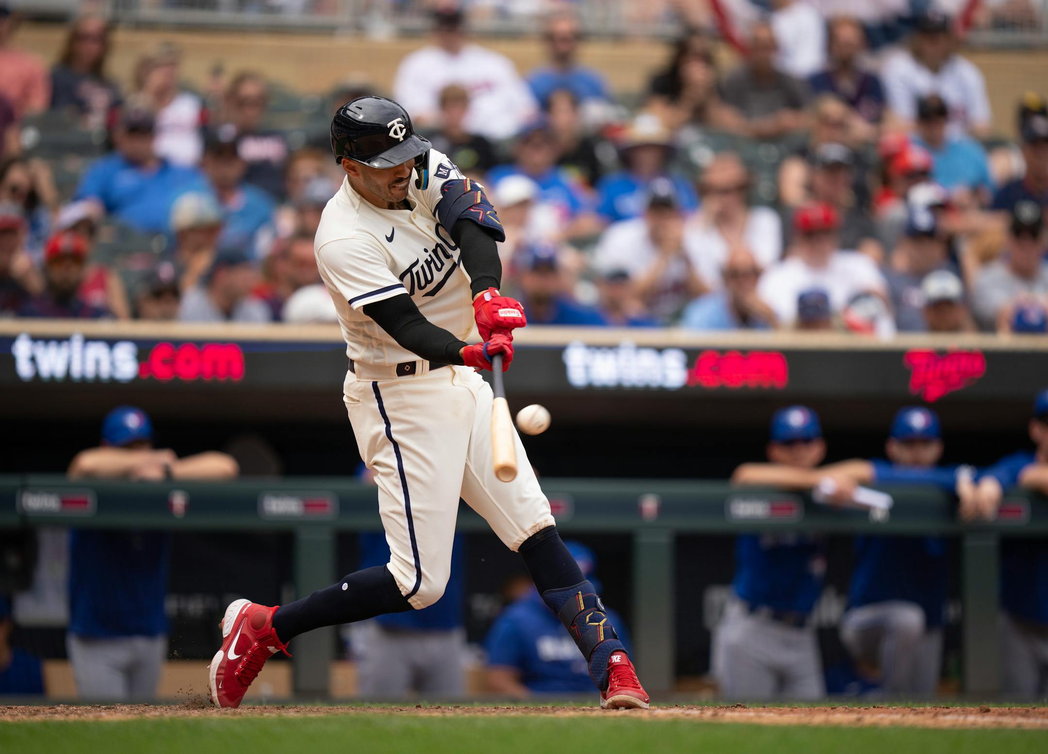 Minnesota Twins shortstop Carlos Correa (4) went deep to center in the eighth inning, only to have the ball caught by Toronto Blue Jays center fielder Daulton Varsho.