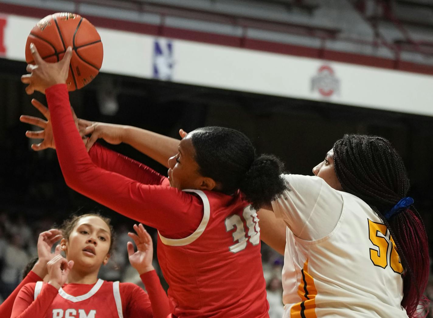 Kendall McGee(30) of BSM battles Jordyn Johnson(50) of DeLaSalle for a loose ball in Minneapolis, Minn., on Wednesday, March 15, 2023. This for the third quarterfinal of the Class 3A girls basketball state tournament, DeLaSalle vs. Benilde-St. Margaret's. ] RICHARD TSONG-TAATARII • richard.tsong-taatarii @startribune.com