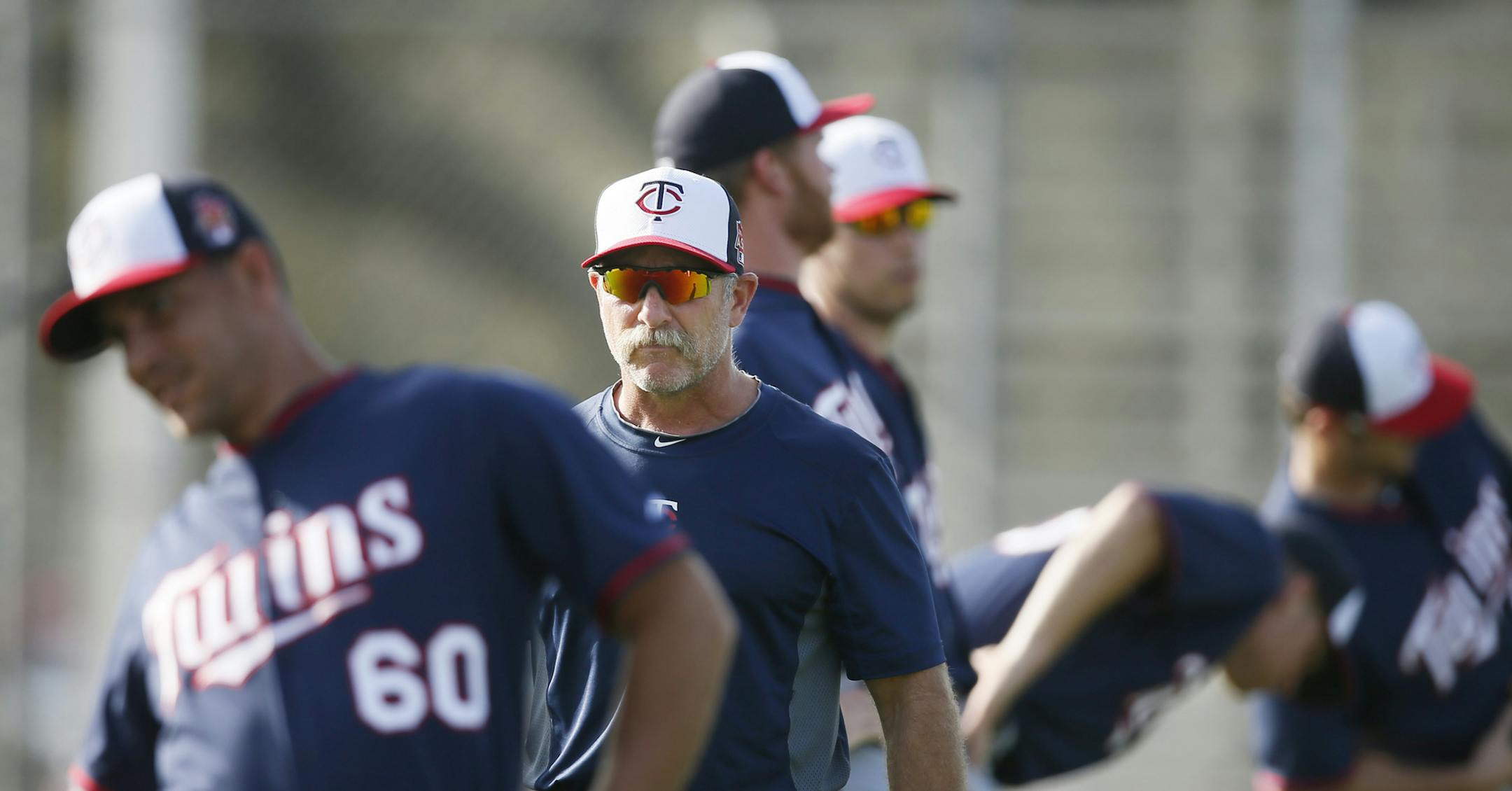 Twins head trainer Perry Castellano lead a warmup session with the pitchers Friday Feb 21. 2014 in Fort Myers, Florida at Lee County Sports Complex. Note these photos go with Jim Souhan Sunday story and should not be used in the daily photo gallery .] JERRY HOLT jerry.holt@startribune.com Jerry Holt