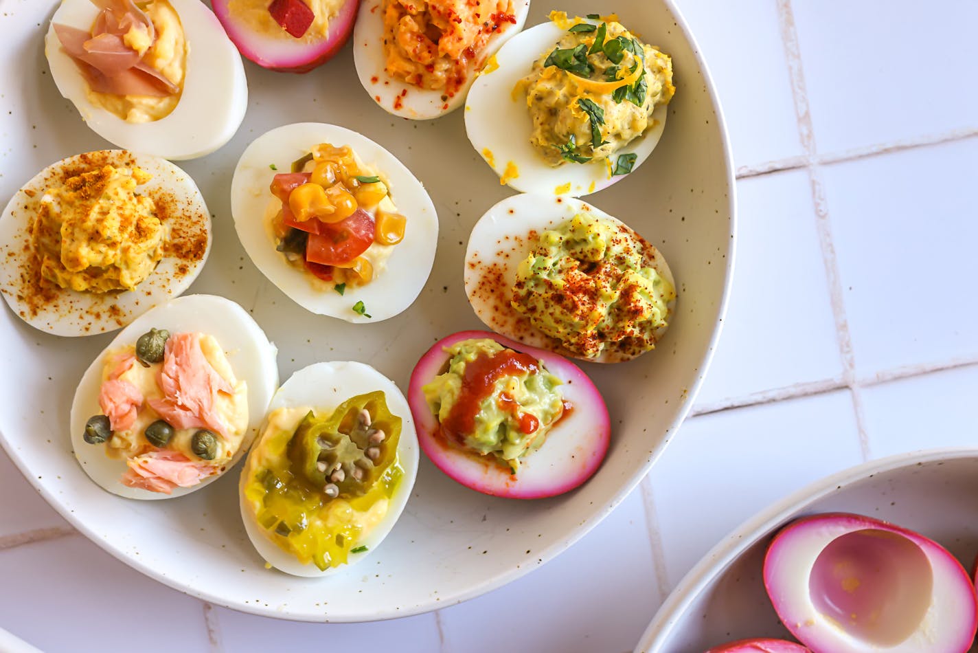 Twelve variations of deviled eggs you can make, from Tex Mex and smoked salmon and Asian peanut and pickled beets.