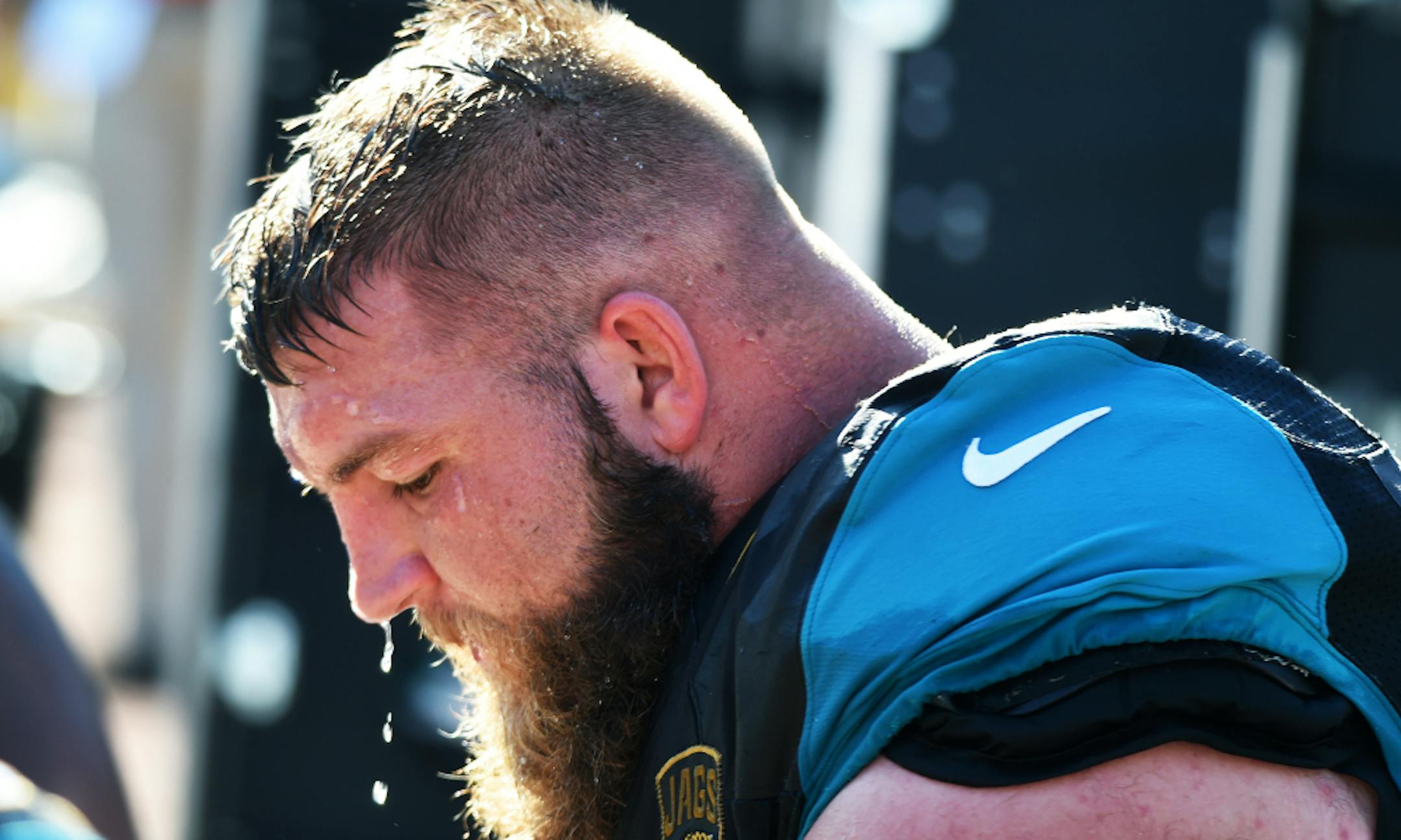 Jacksonville Jaguars guard Tyler Shatley (69) cools off on the bench during play against the Tennessee Titans during a week 16 NFL football game Dec. 24, 2016 in Jacksonville, Fla. The Jaguars won 38 - 17. (Al Messerschmidt via AP)