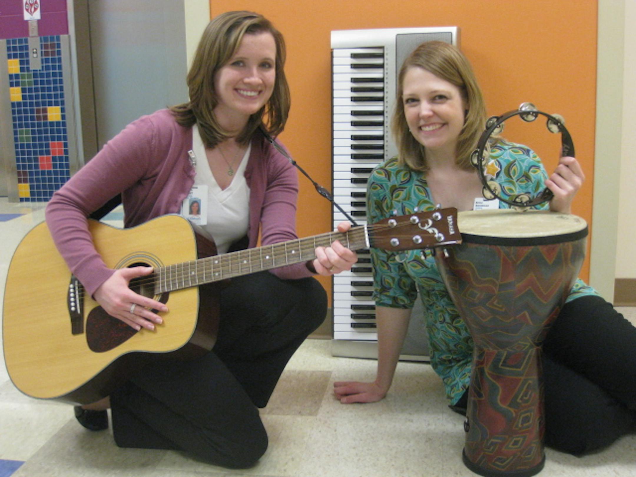 Erinn Frees (right), a music therapist at Children's, tells us five things you may not know about music therapy. At left is music therapist Kim Arter.