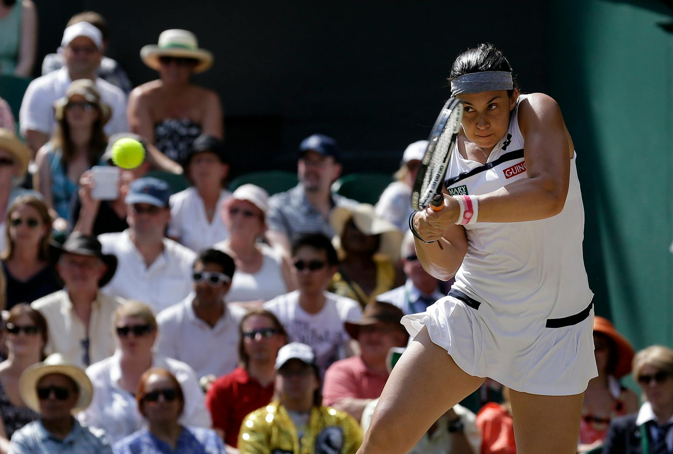 Marion Bartoli of France returns to Sabine Lisicki of Germany during their Women's singles final match at the All England Lawn Tennis Championships in Wimbledon, London, Saturday, July 6, 2013. (AP Photo/Anja Niedringhaus)