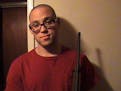 Christopher Harper-Mercer is shown on a MySpace page holding a rifle.