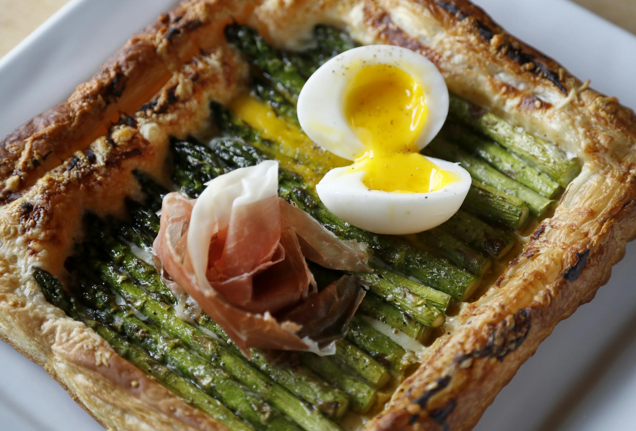 Asparagus Galette. Gruyere, Dijon, prosciutto, egg and lemon at the New Scenic Cafe up the shore north of Duluth. ] CARLOS GONZALEZ cgonzalez@startribune.com - June 4, 2016, Duluth, MN, Taste Section Story Food, Coffee, Drinks, Bars and Restaurants of the Duluth Area ORG XMIT: MIN1606061920252183