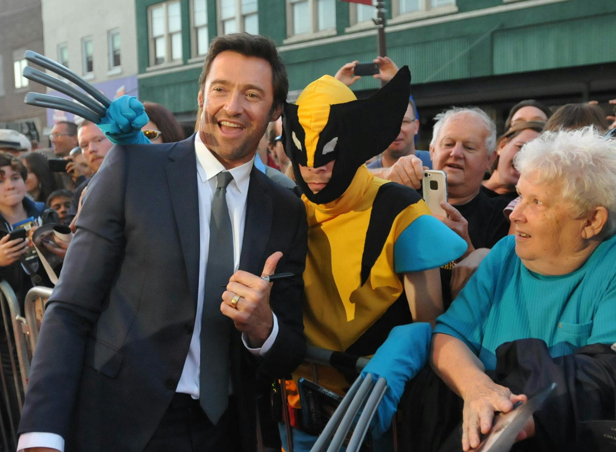 Hugh Jackman greets fans outside the Metropolitan Theater in Iowa Falls, Saturday Sept. 21, 2013, for the reopening of the Metropolitan Theater, the northern Iowa cityís 114-year-old movie theater. (AP Photo/Waterloo Courier, Dennis Magee)