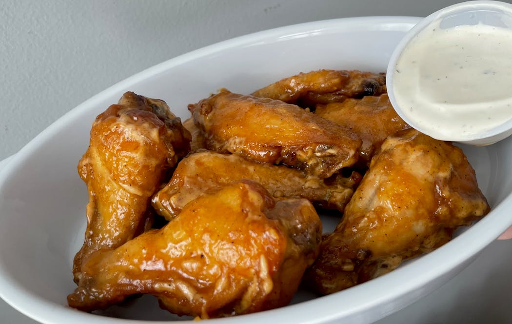 Alabama white barbecue sauce adds a creamy, twangy kick to Mario’s wings.