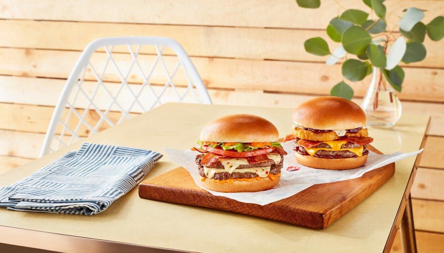 Dairy Queen is introducing new "Stackburgers," including the "FlameThrower"&nbsp;on the left and the "Loaded A.1." on the right.