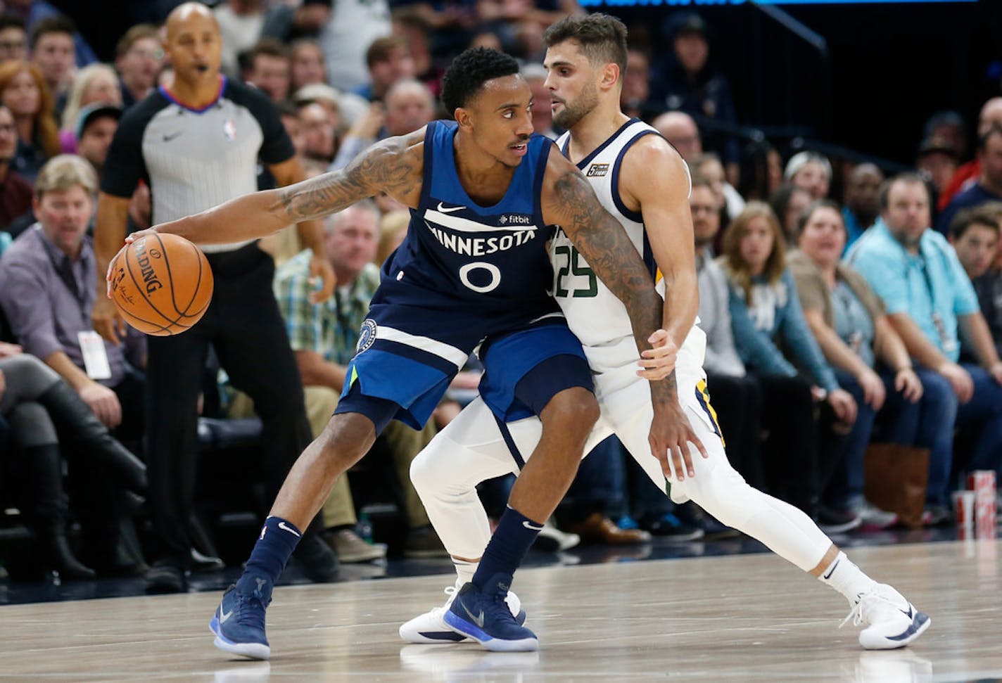 Utah Jazz guard Raul Neto (25) guards Minnesota Timberwolves guard Jeff Teague (0) in the second half during an NBA basketball game Monday, Nov. 13, 2017, in Salt Lake City. (AP Photo/Rick Bowmer)