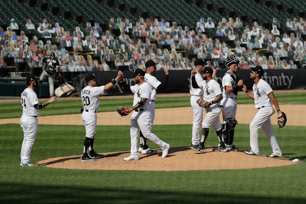 Chicago White Sox players celebrate after they defeated the Twins in a game on Saturday