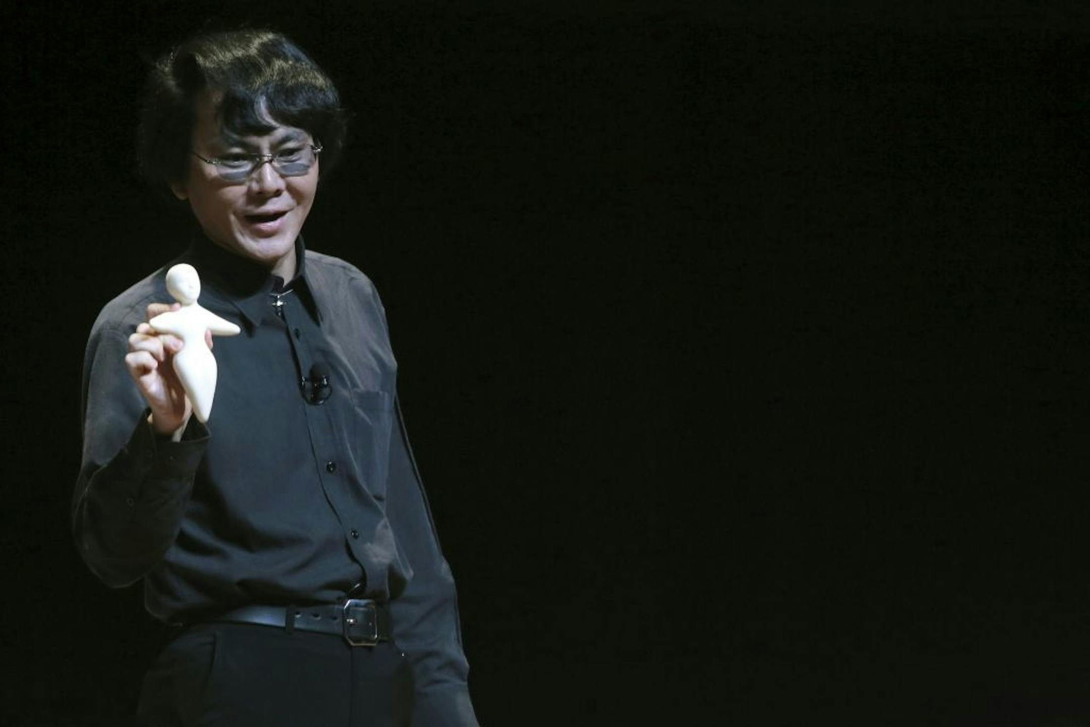 Dr. Hiroshi Ishiguro holds a model of a Telenoid as he addresses the Global Future 2045 Congress, Saturday, June 15, 2013 at Lincoln Center in New York. Some of humanity�s best brains are gathering in New York to discuss how our minds can outlive our bodies. The conference is funded by a Russian billionaire with an aggressive time schedule: immortality by 2045.